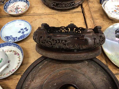 Lot 14 - Three good carved wood Chinese stands and a Chinese carved wood figure converted to a lamp