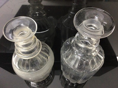Lot 56 - Two Georgian cut glass ring neck decanters